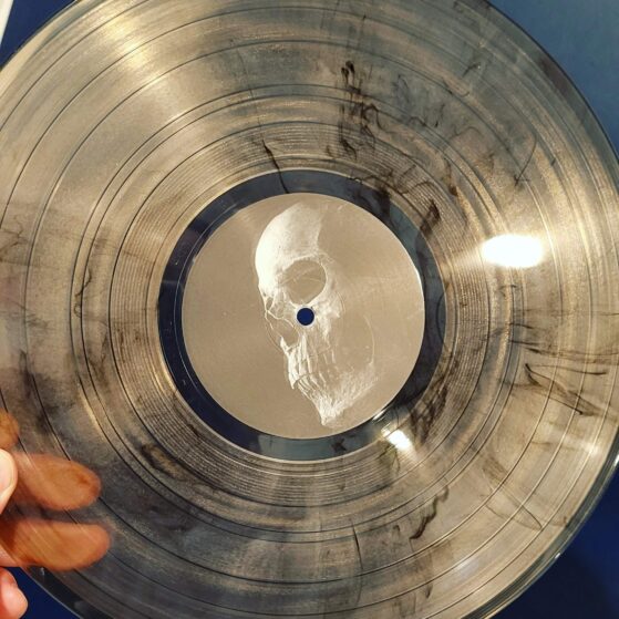 Vinyl record with clear base and black marble effect